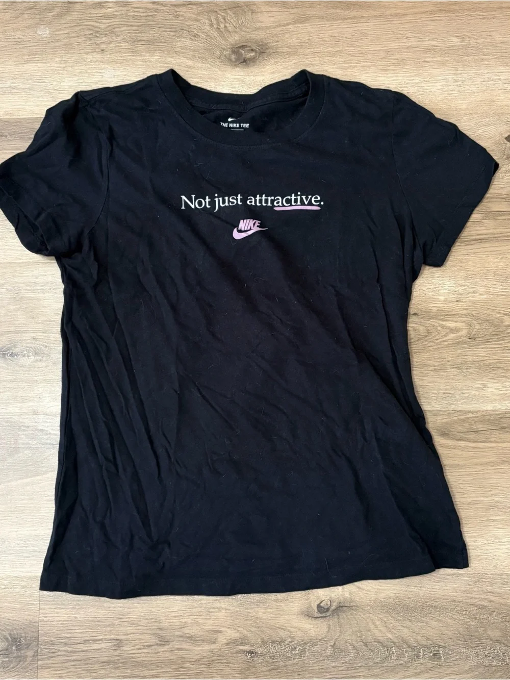 Nike Women’s Black Graphic Tee — Not Just Attractive
